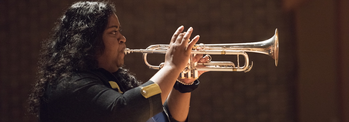 girl playing the trumpet